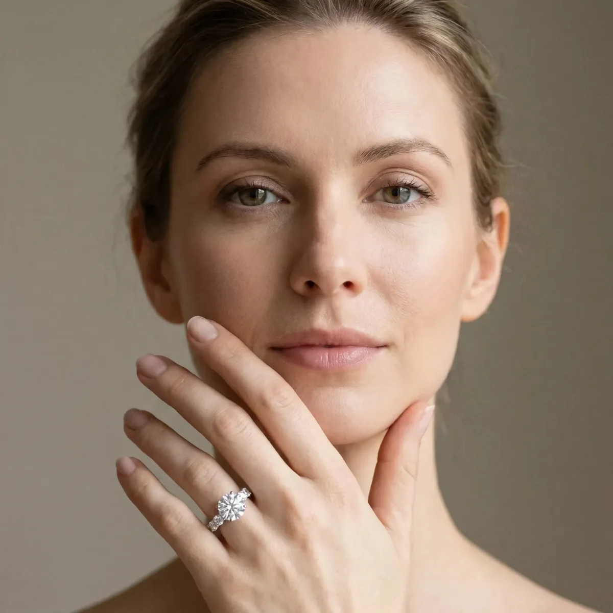 Round Cut Diamond Side Stone Engagement Ring with Four-Prong Setting Platinum