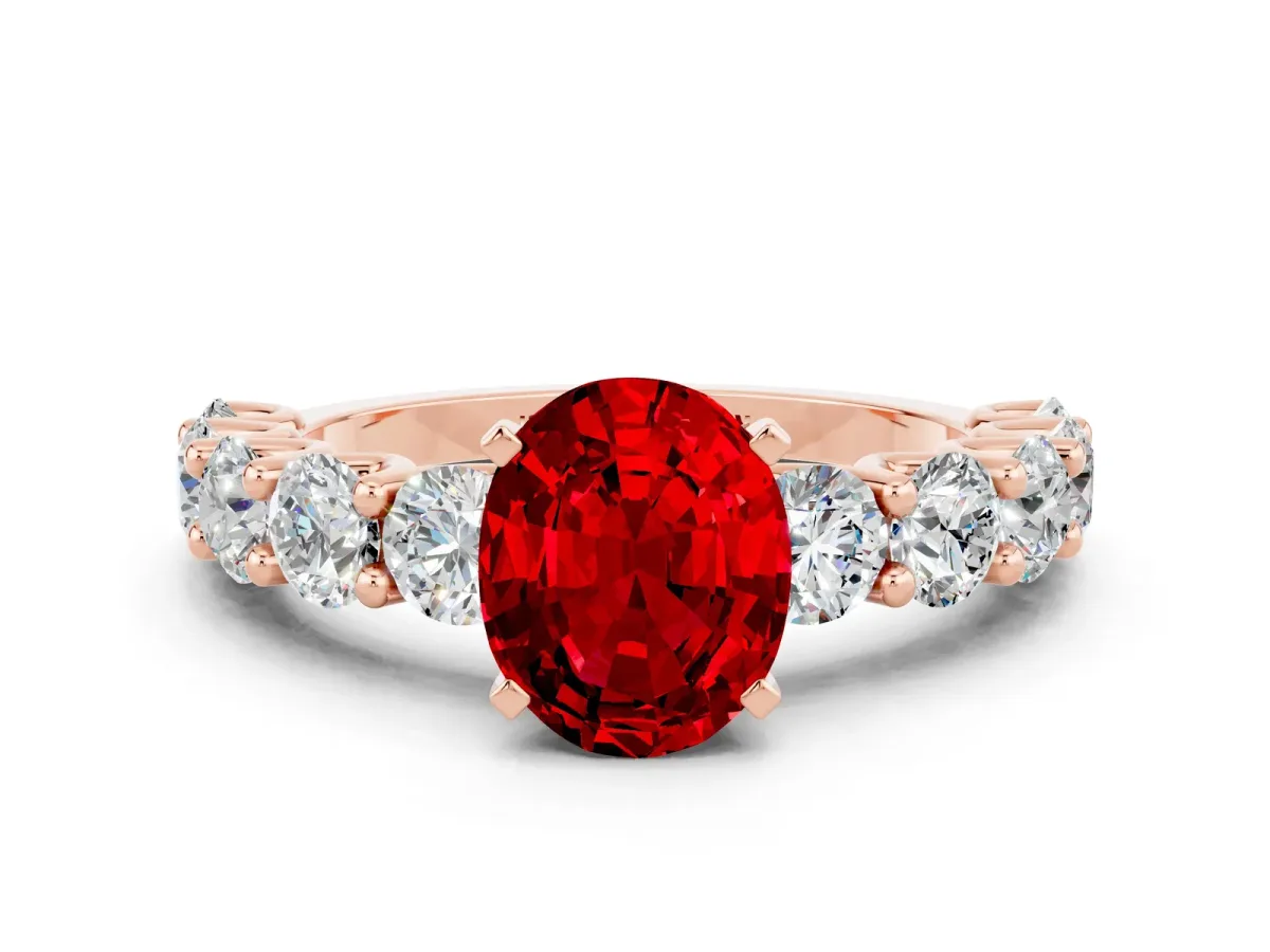 Oval Cut Ruby Prong Setting with Side Stones on a Pave Band Rose gold