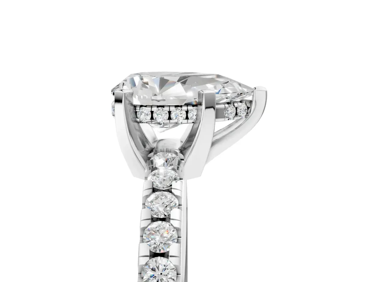 Pear Cut Diamond Solitaire Ring with Round Moissanite Pavé Band and Four-Prong Setting Silver