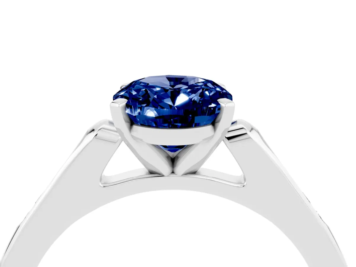 Oval Cut Blue Sapphire Solitaire Ring with Channel Set Round Band and Prong Setting Silver