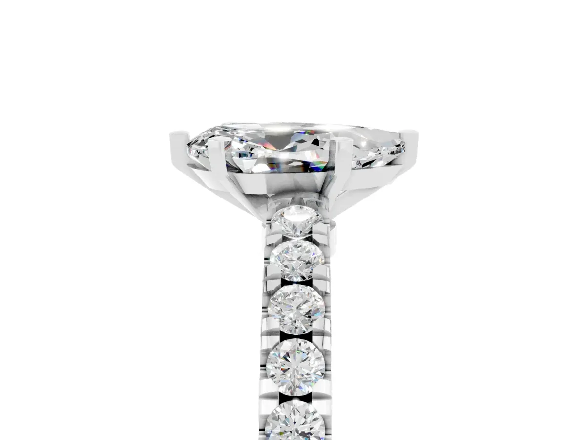Pear Cut Solitaire Moissanite with Pavé Band and Four-Prong Setting Silver
