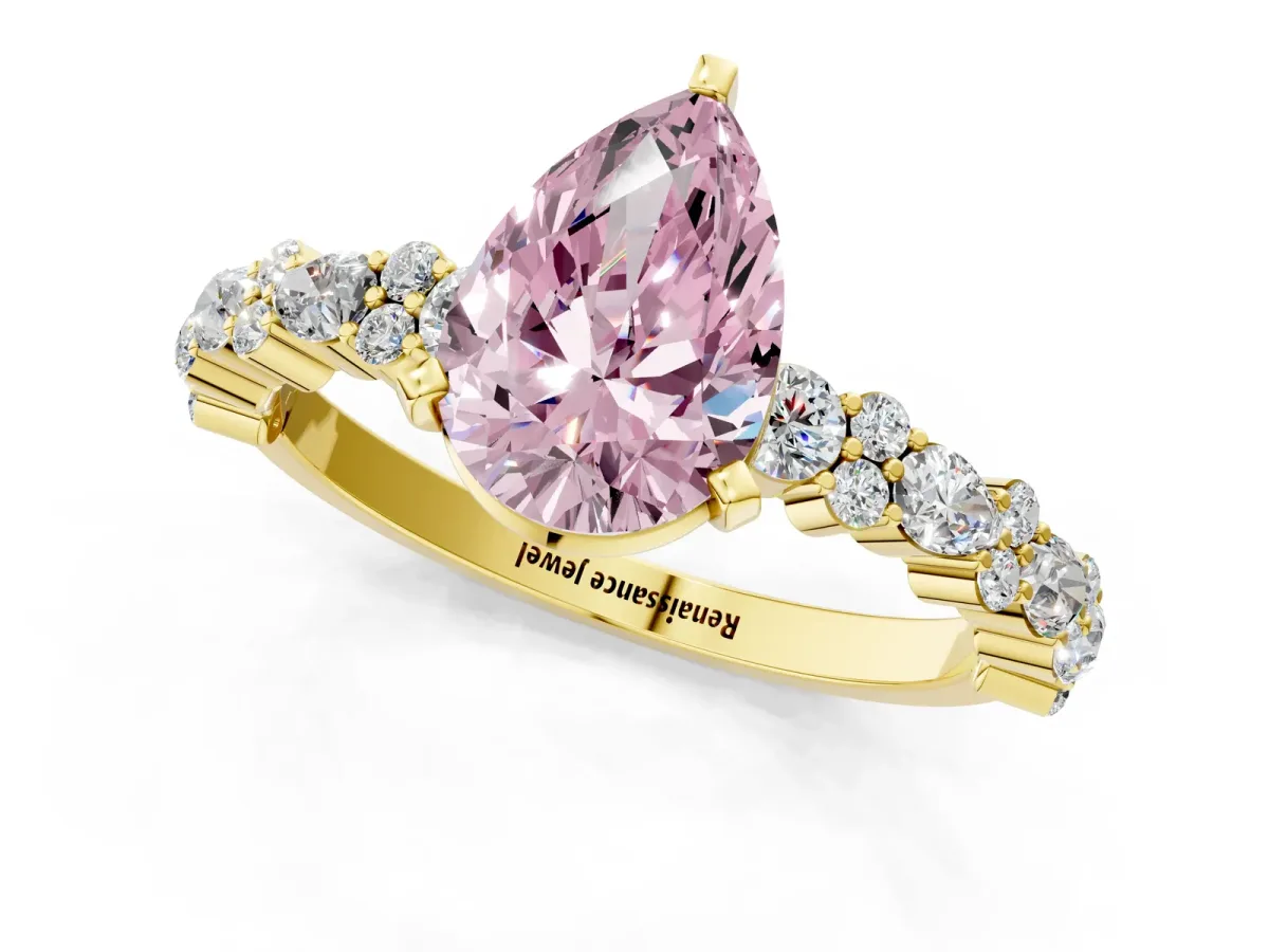 Fancy Pink Pear Cut Diamond Side Stone Solitaire Ring with Round and Four-Prong Setting Yellow gold