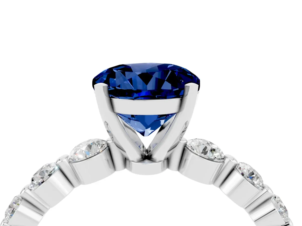 Round Cut Solitaire Blue Sapphire Ring with Pave Band and Four-Prong Setting Silver
