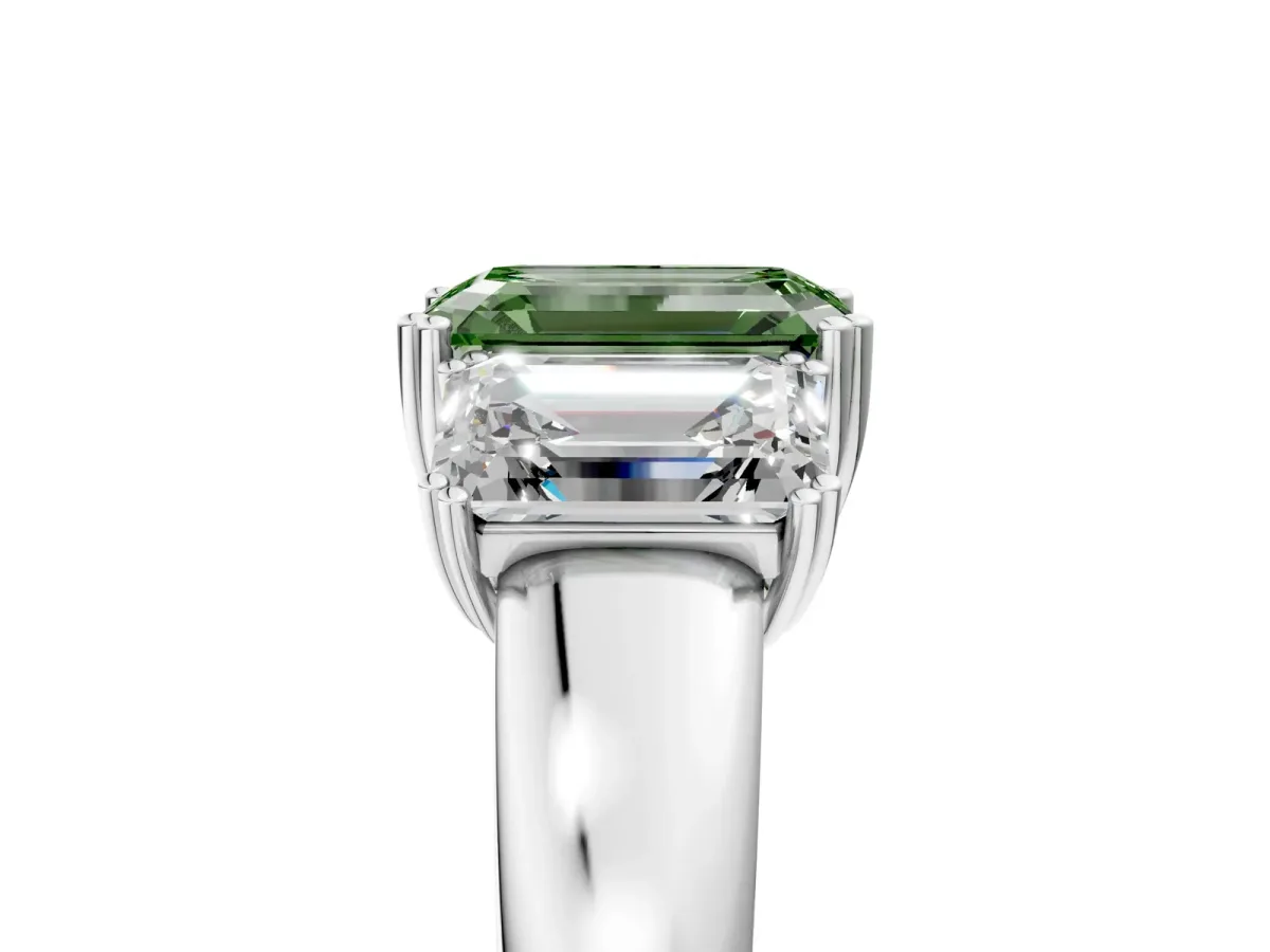 Fancy Green Three-Stone Emerald Cut Cut Diamond Ring with Channel Set Band and Four-Prong Setting Platinum