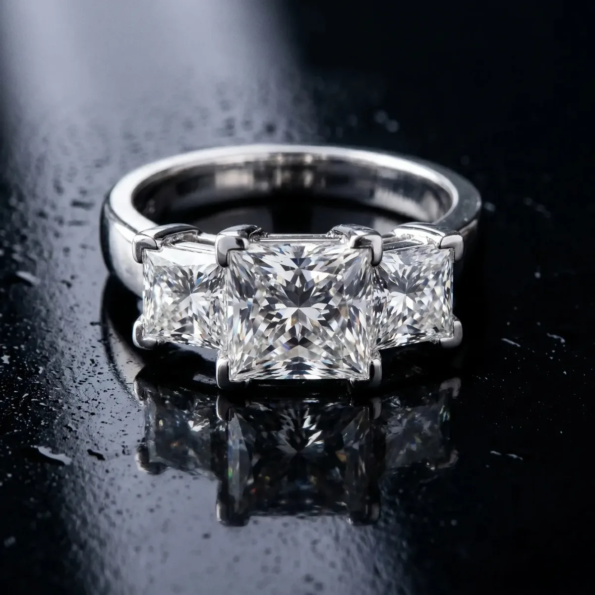 Three-Stone Princess Cut Cut Diamond Ring with Channel Set Band and Four-Prong Setting Platinum