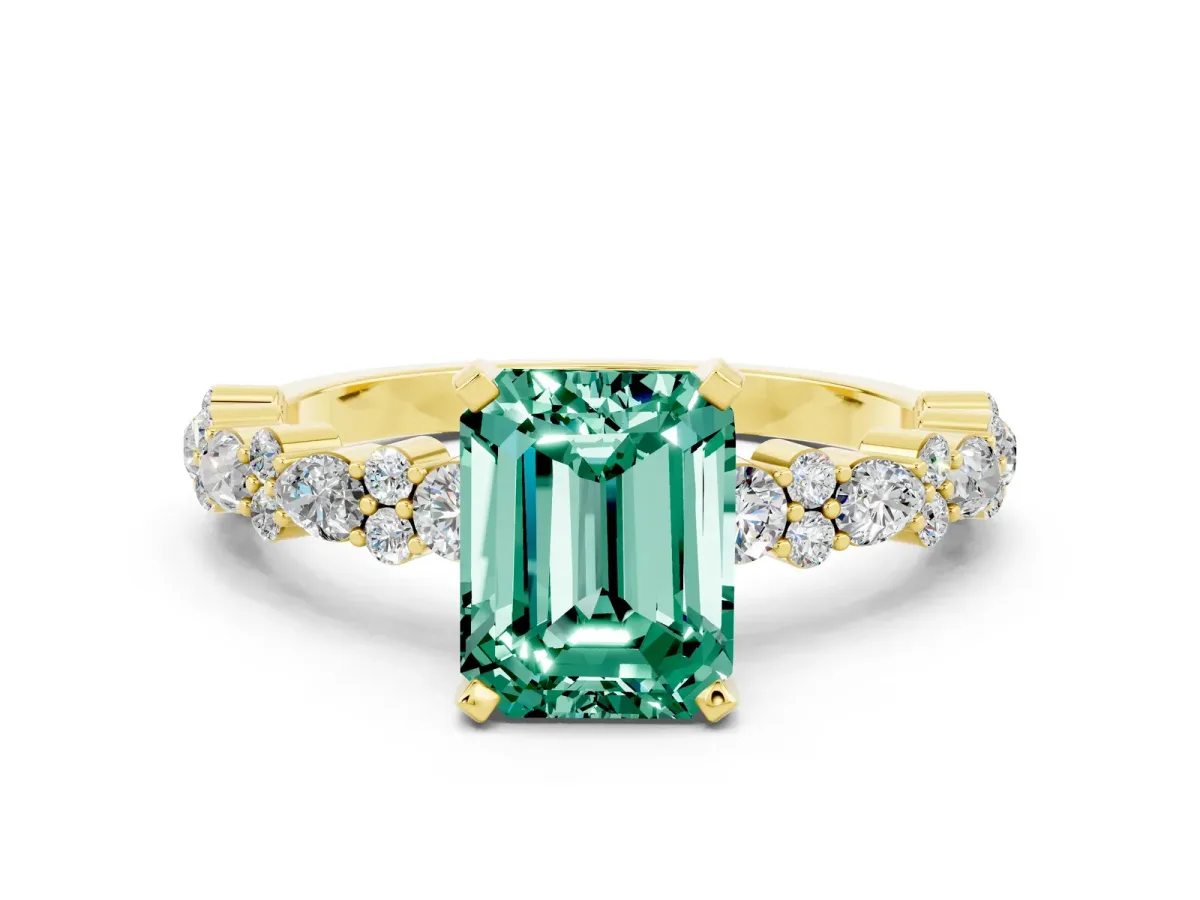 Emerald Cut Green Sapphire Side Stone Solitaire Ring with Round and Four-Prong Setting Yellow gold