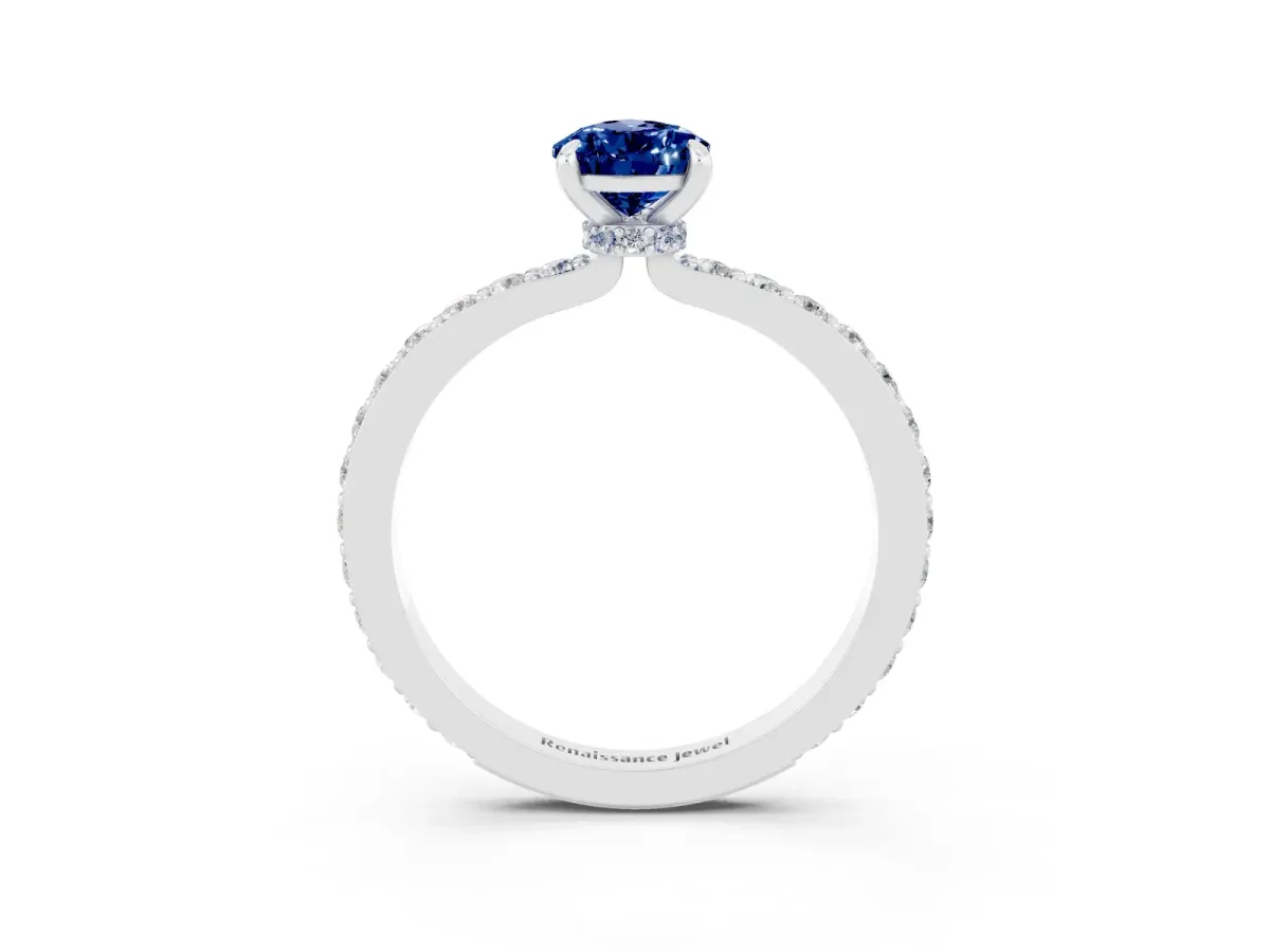Pear Cut Blue Sapphire Solitaire Engagement Ring with Pavé Band and Four-Prong Setting Silver