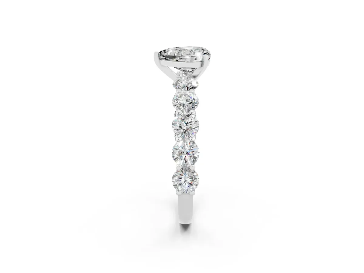 Heart Cut Moissanite Prong Setting with Side Stones on a Pave Band Silver