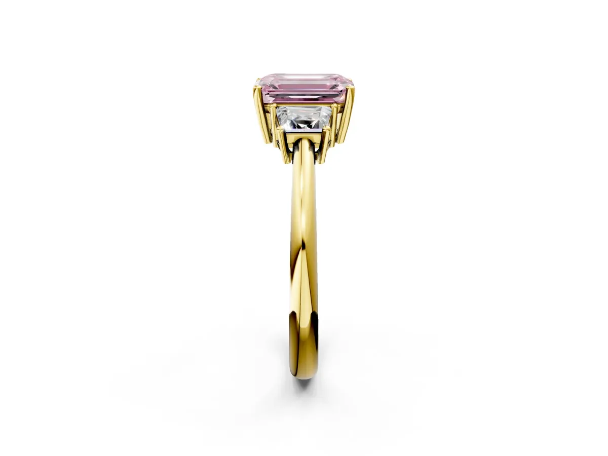 Fancy Pink Emerald Cut Diamond Three-Stone Ring with Trapezoid Side Stones and Prong Setting Yellow gold