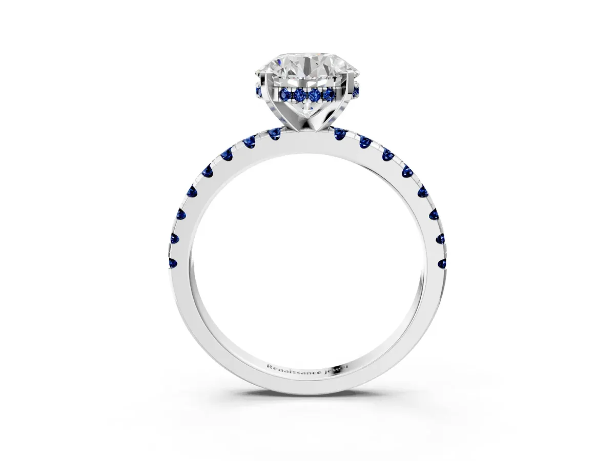 Round Cut Diamond Solitaire Ring with Round Blue Sapphire Pavé Band and Four-Prong Setting Silver