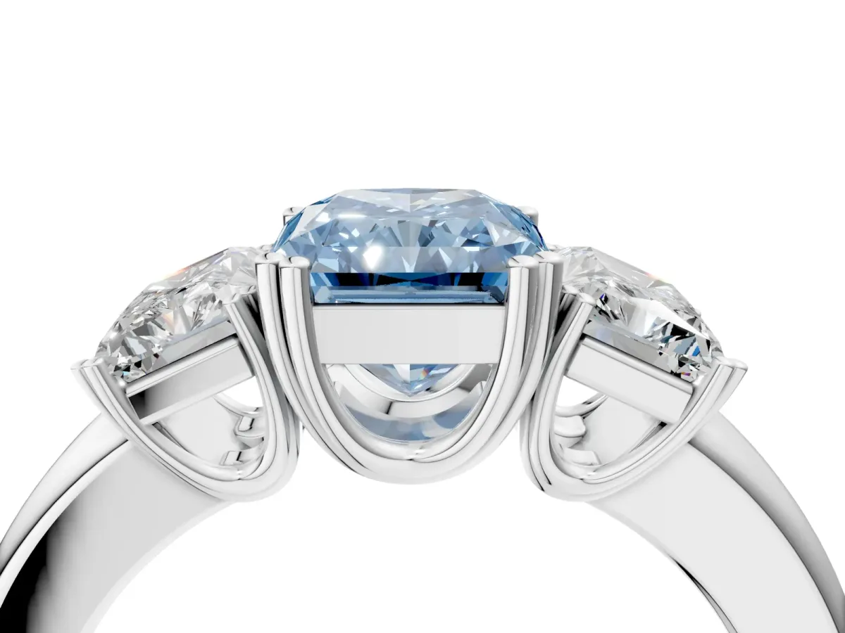 Fancy Blue Three-Stone Radiant Cut Cut Diamond Ring with Channel Set Band and Four-Prong Setting Silver