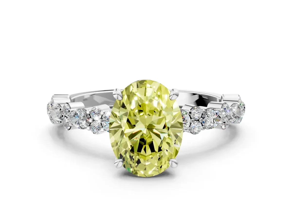 Fancy Yellow Oval Cut Diamond Side Stone Solitaire Ring with Round and Four-Prong Setting White gold