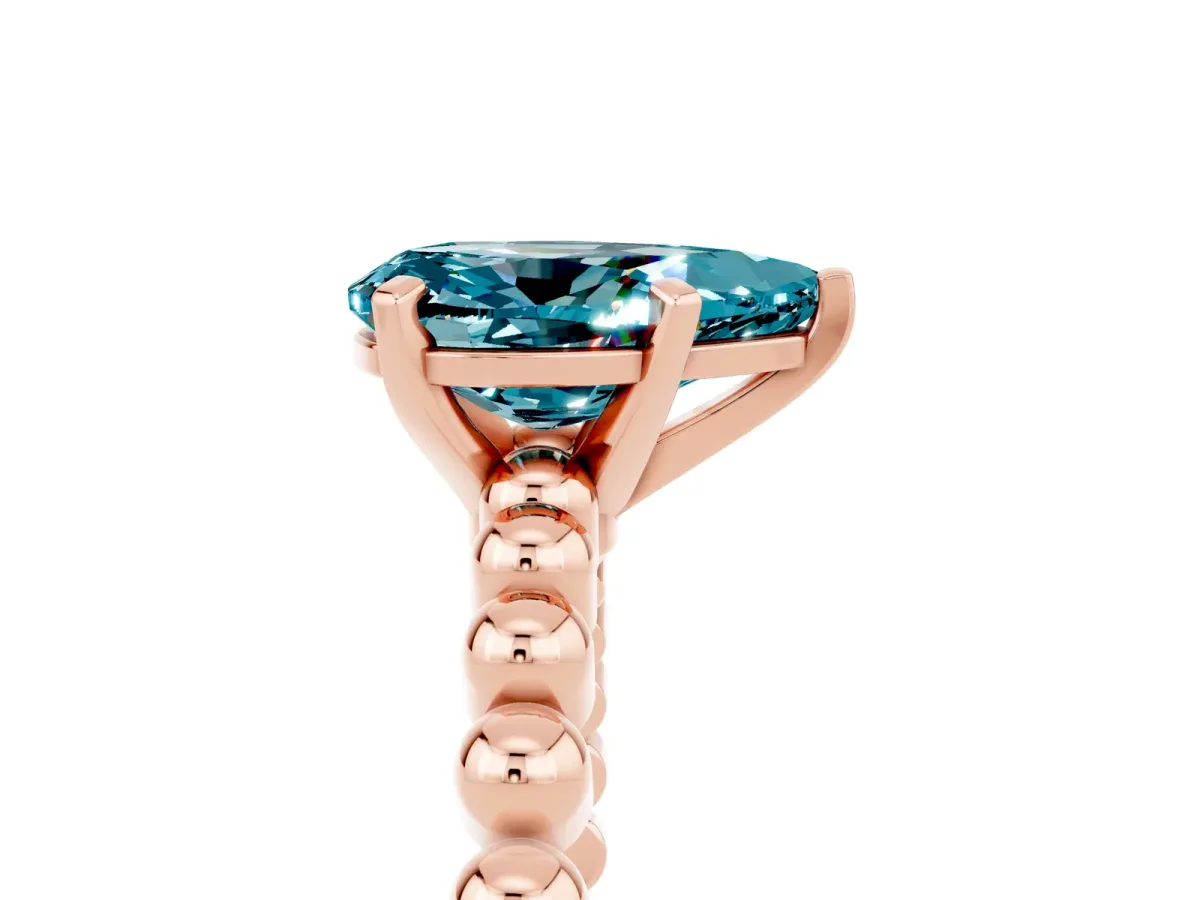 Pear Cut Blue Topaz Solitaire Ring with Beaded Band and Prong Setting Rose gold