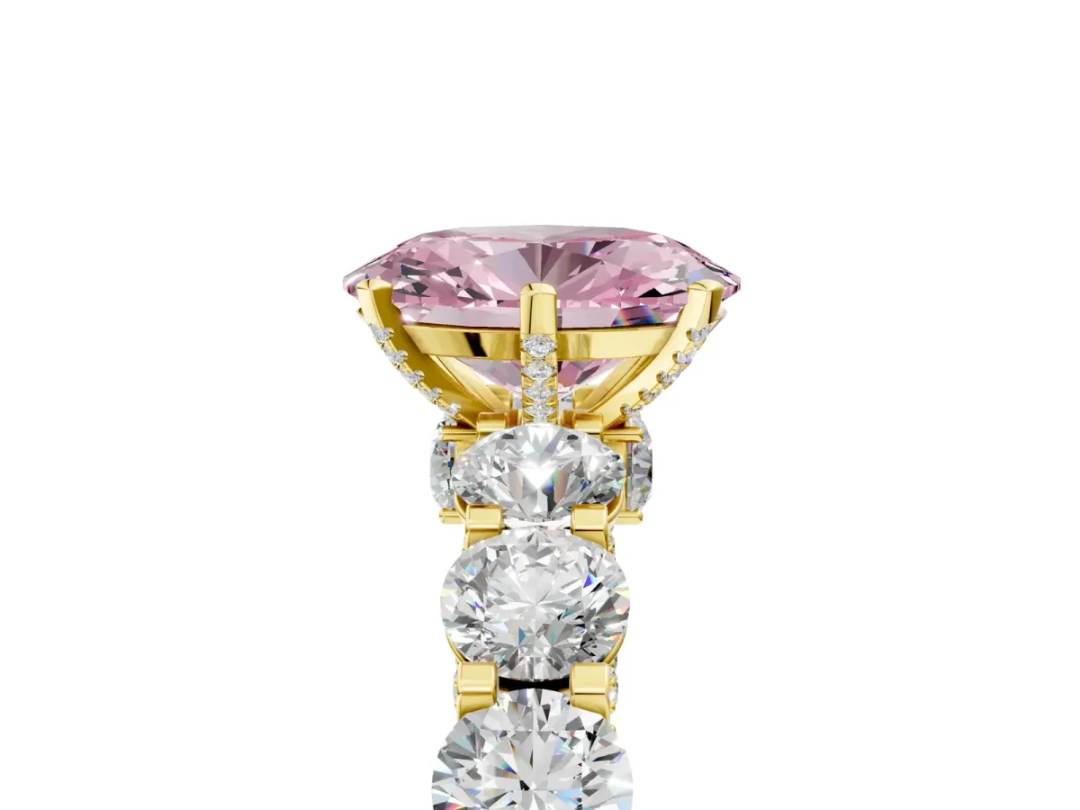 Fancy Pink Oval Cut Diamond Side Stone Engagement Ring with Four-Prong Setting Yellow gold