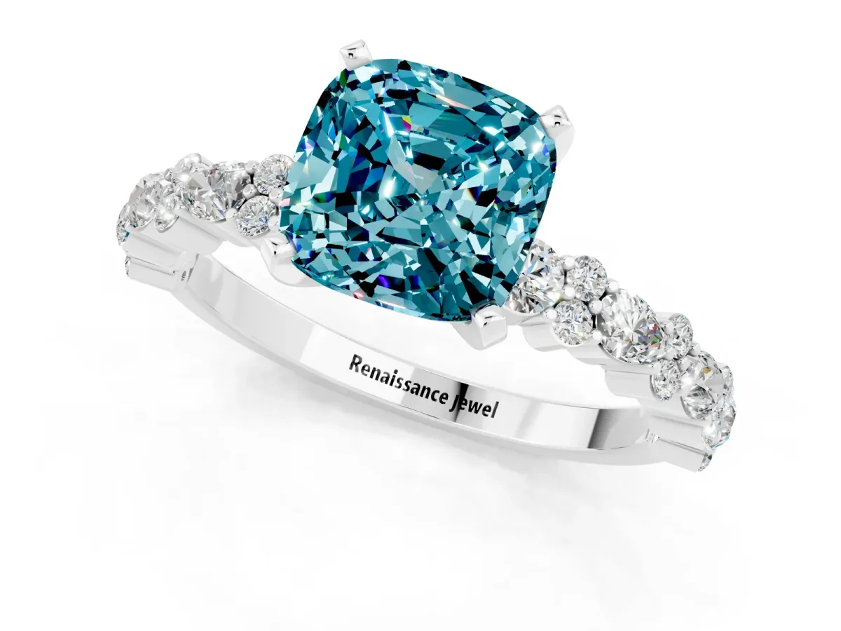 Cushion Cut Blue Topaz Side Stone Solitaire Ring with Round and Four-Prong Setting Platinum