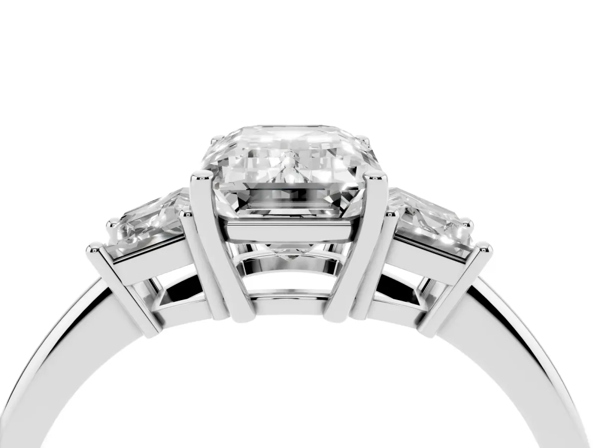 Emerald Cut Diamond Three-Stone Ring with Trapezoid Side Stones and Prong Setting White gold