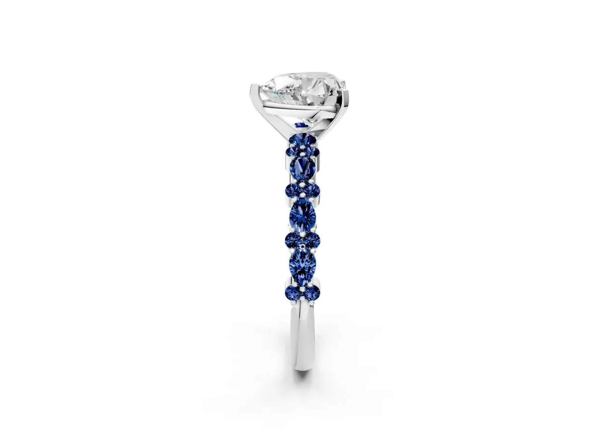 Heart Cut Diamond Side Stone Solitaire Ring with Round Blue Sapphire and Four-Prong Setting Platinum