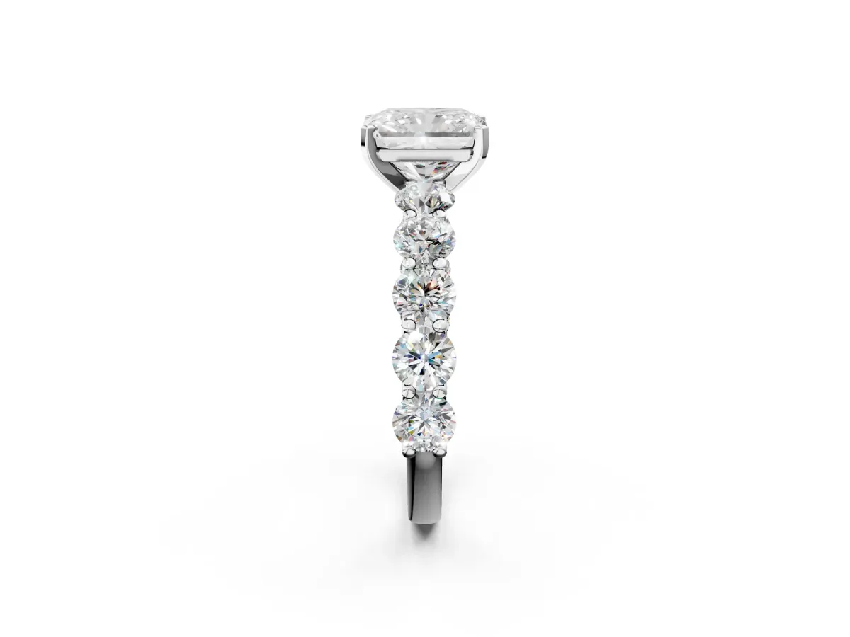 Radiant Cut Diamond Prong Setting with Side Stones on a Pave Band Platinum