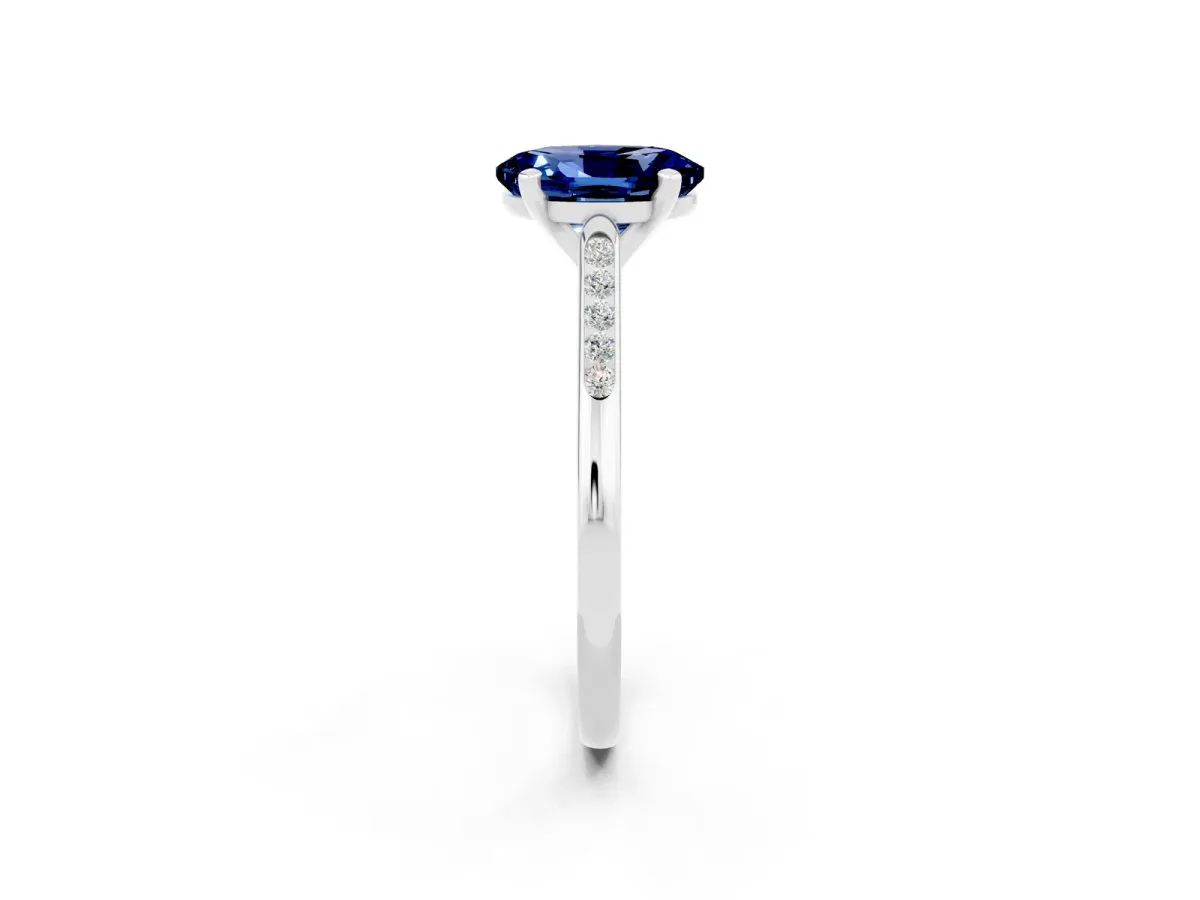 Oval Cut Blue Sapphire Solitaire Ring with Channel Set Round Band and Prong Setting Silver