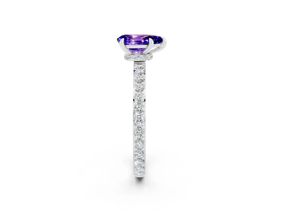 Pear Cut Tanzanite Solitaire Engagement Ring with Pavé Band and Four-Prong Setting Silver
