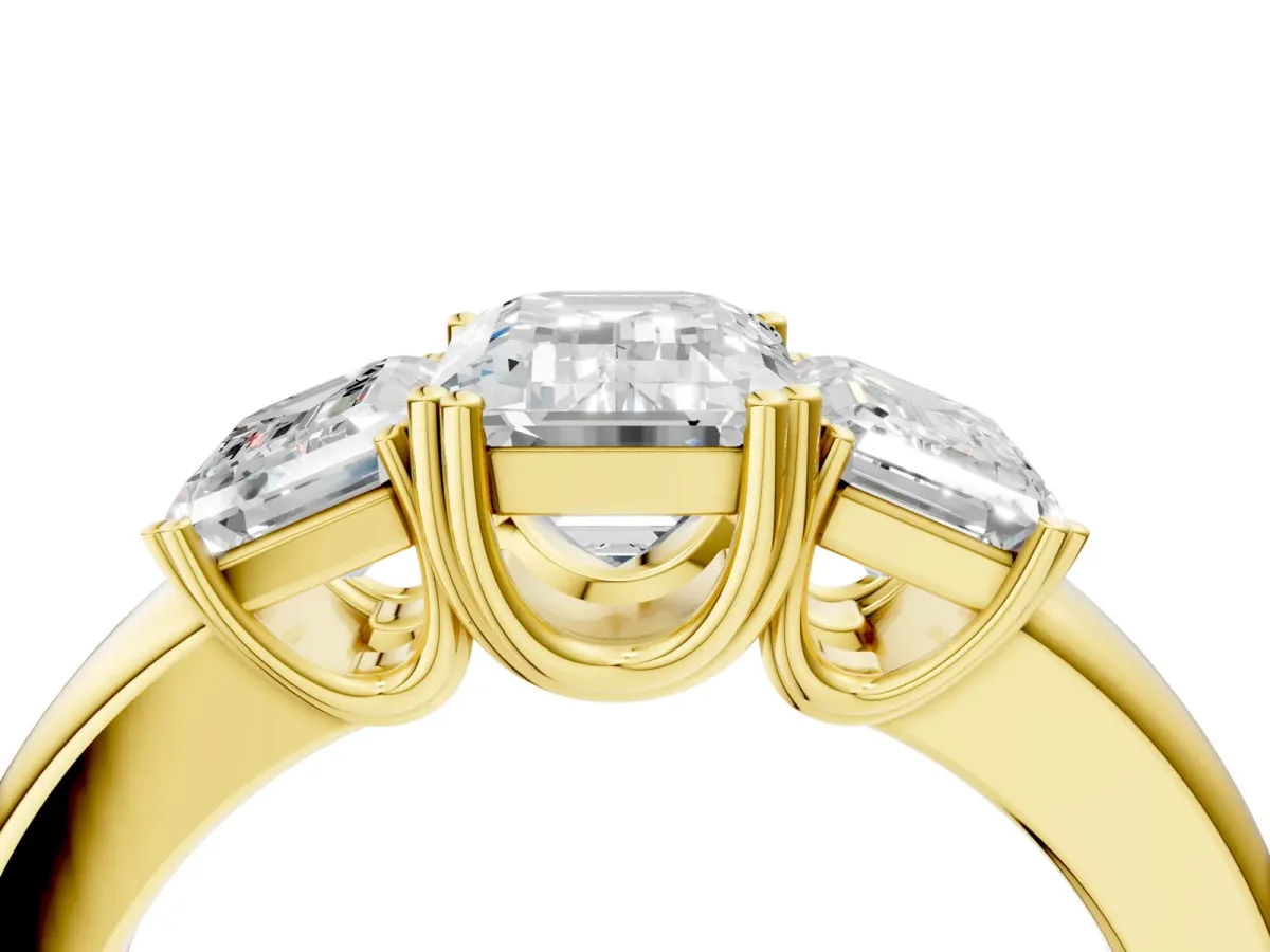 Three-Stone Emerald Cut Cut Diamond Ring with Channel Set Band and Four-Prong Setting Yellow gold