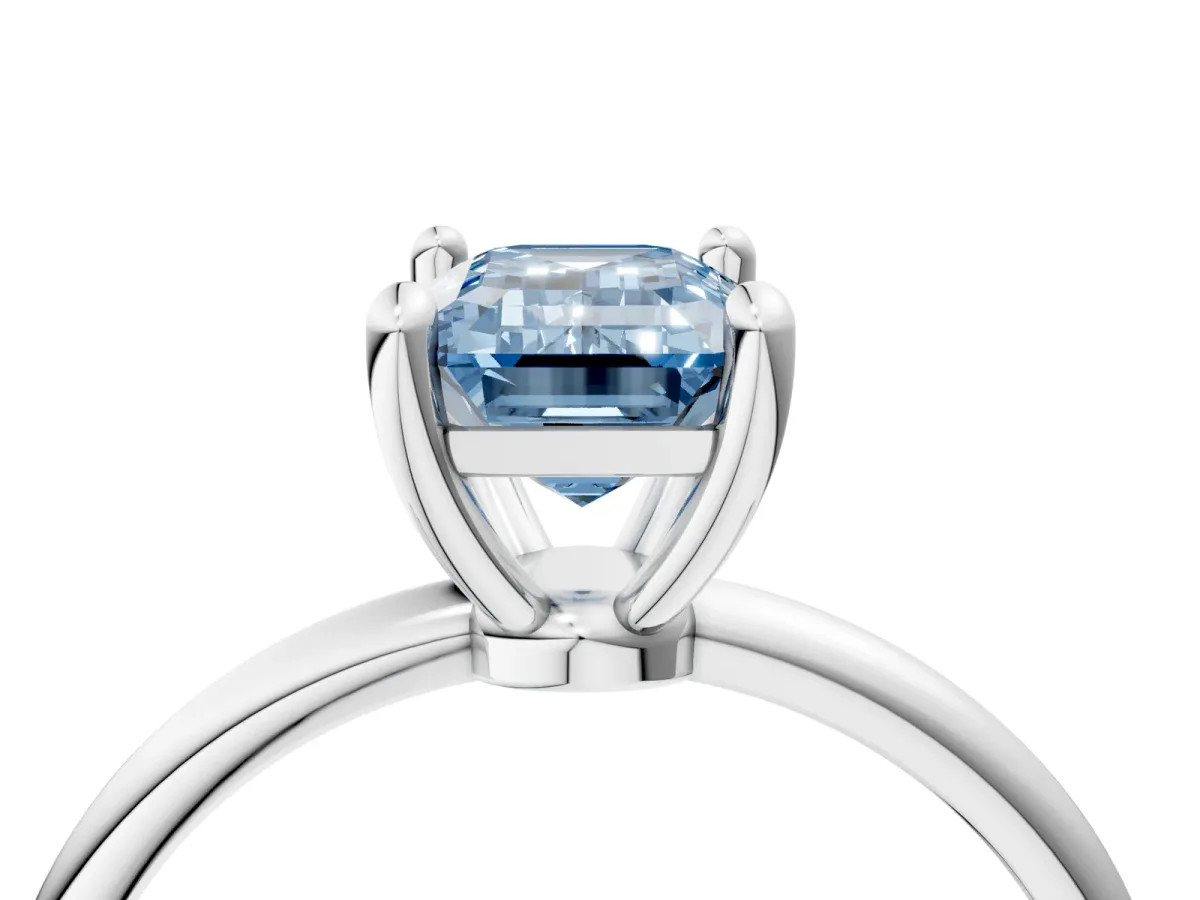Fancy Blue Emerald Cut Solitaire Diamond Ring with 4-Prong Setting on a Classic Band Silver