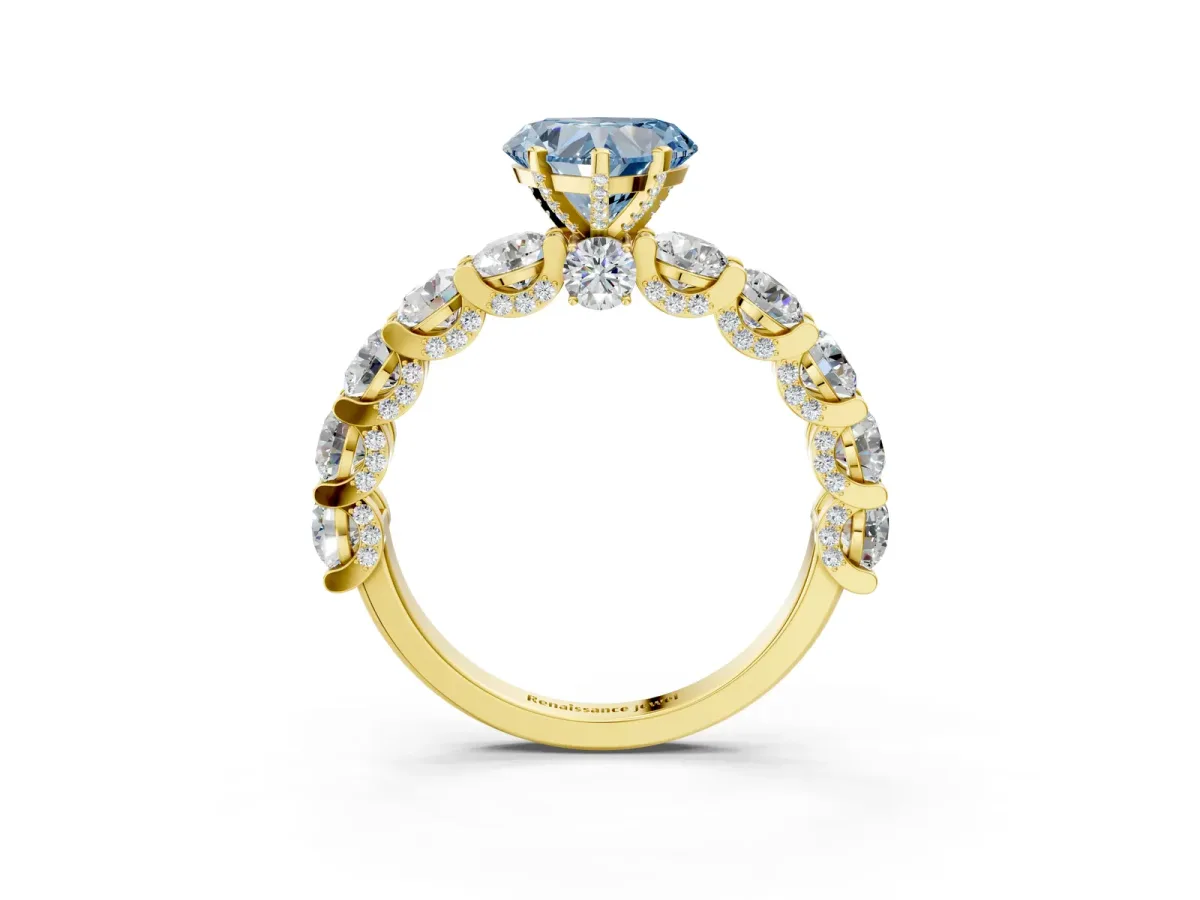 Fancy Blue Heart Cut Diamond Side Stone Engagement Ring with Four-Prong Setting Yellow gold