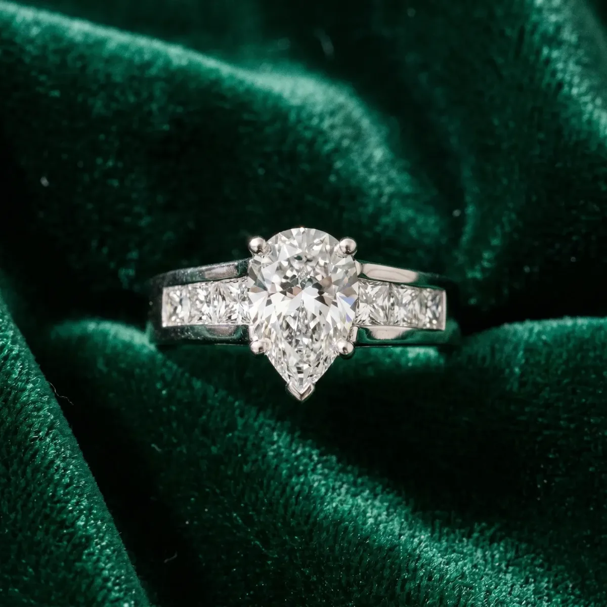 Pear Cut Cut Channel Set Solitaire Ring with Four-Prong Setting White gold