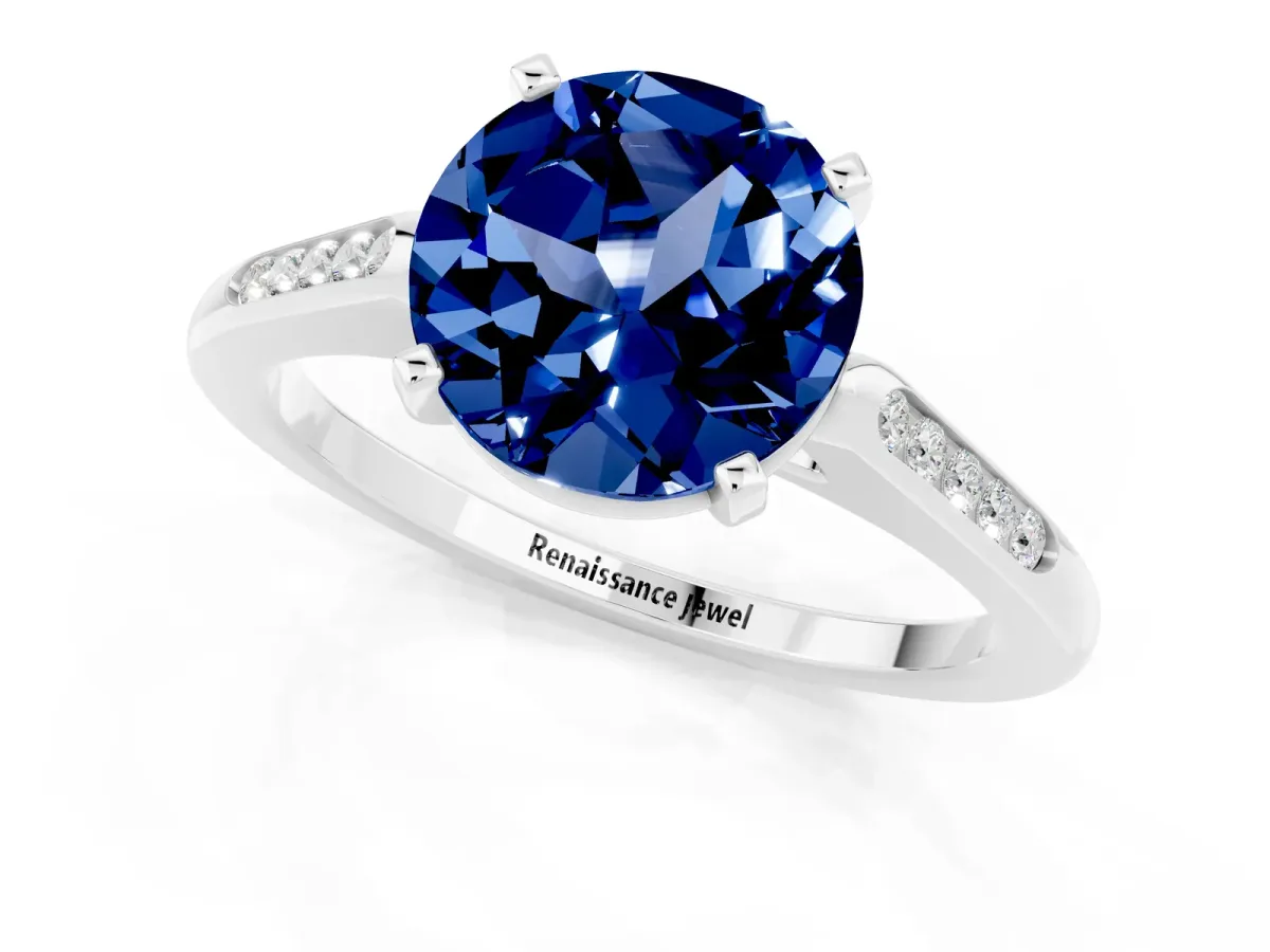 Round Cut Blue Sapphire Solitaire Ring with Channel Set Round Band and Prong Setting Silver