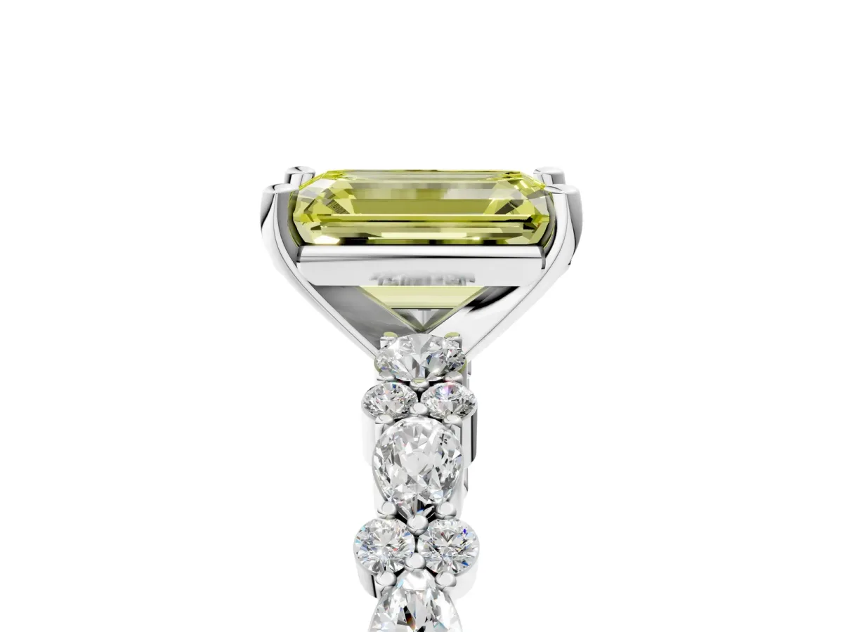 Fancy Yellow Emerald Cut Diamond Side Stone Solitaire Ring with Round and Four-Prong Setting Platinum