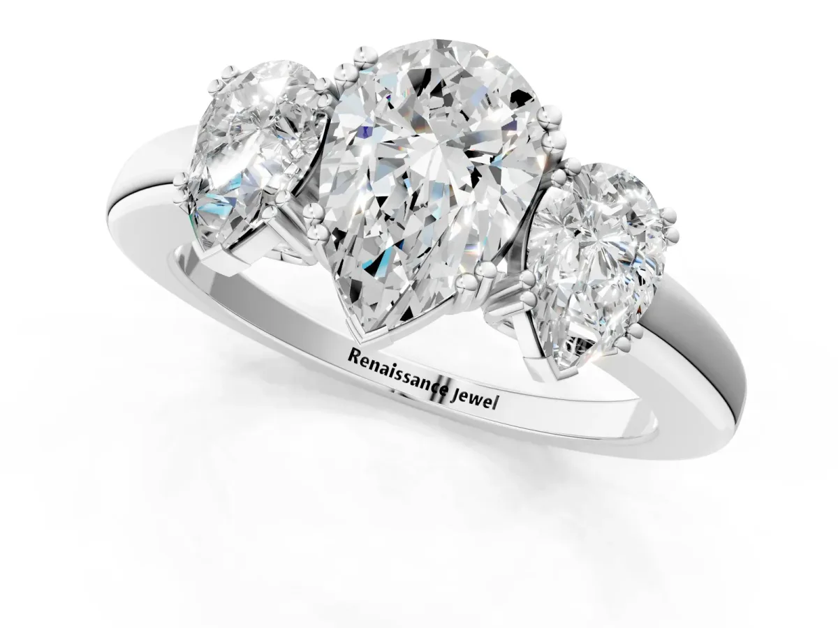 Three-Stone Pear Cut Cut Diamond Ring with Channel Set Band and Four-Prong Setting White gold
