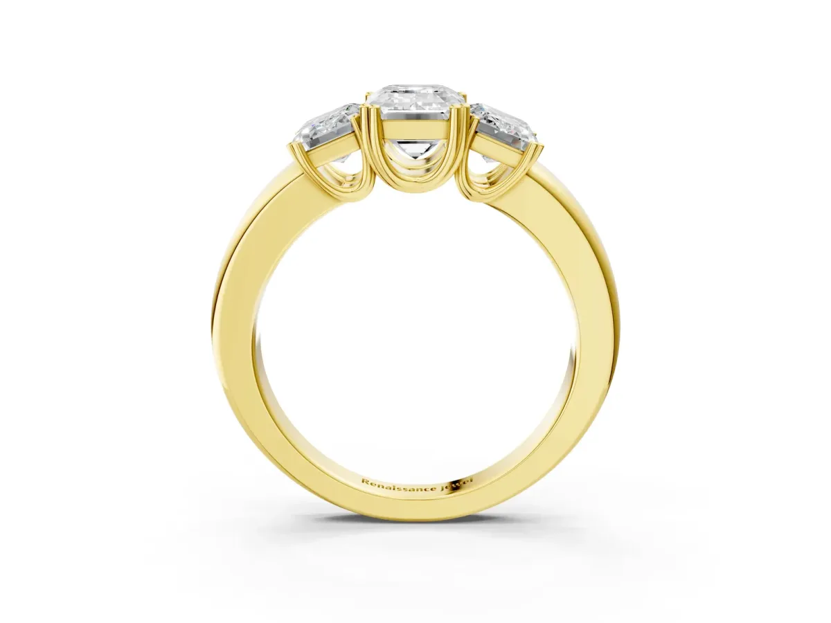 Three-Stone Emerald Cut Cut Diamond Ring with Channel Set Band and Four-Prong Setting Yellow gold