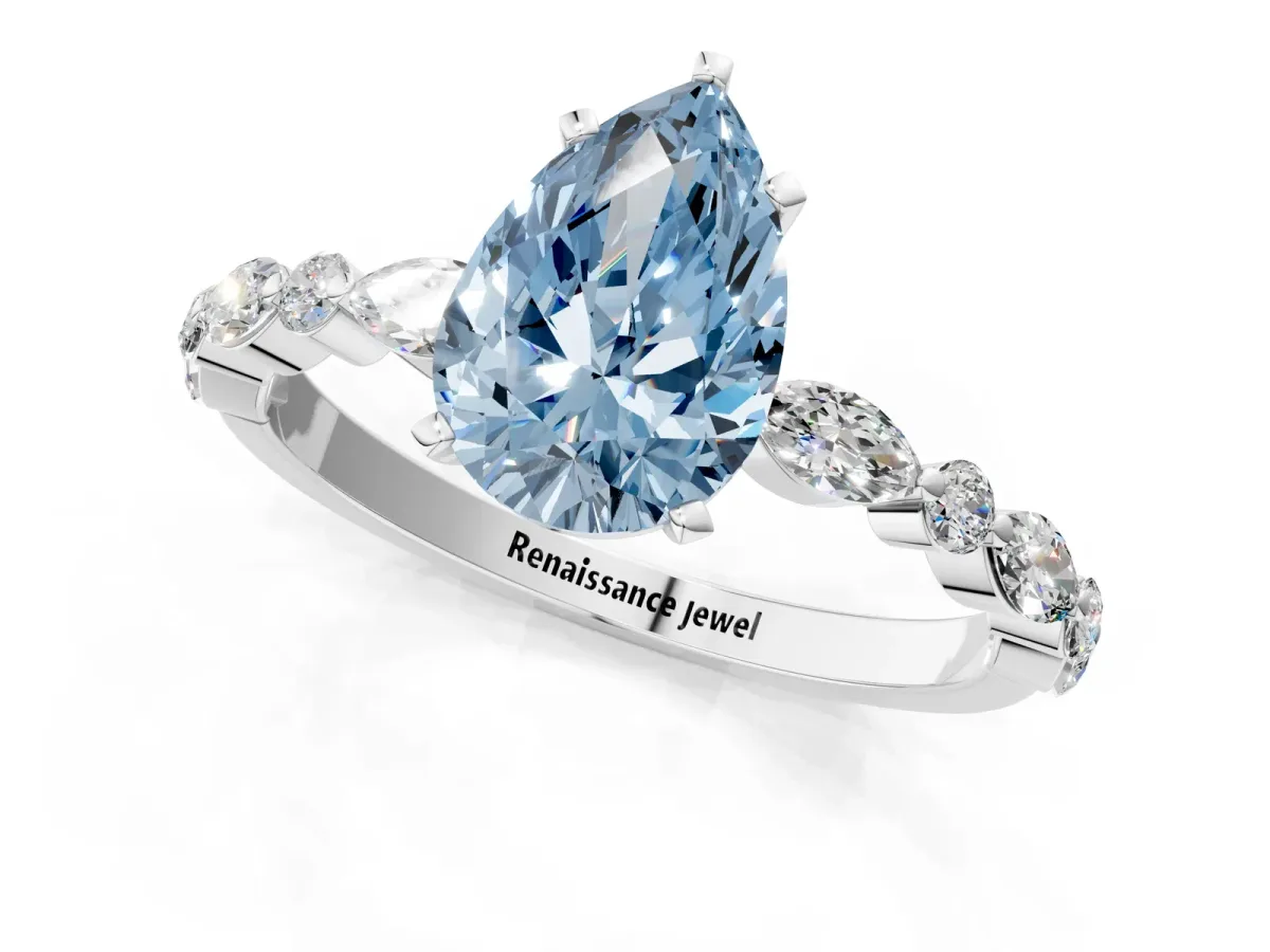 Fancy Blue Pear Cut Diamond Ring with Marquise and Round Side Stones and Four-Prong Setting Silver