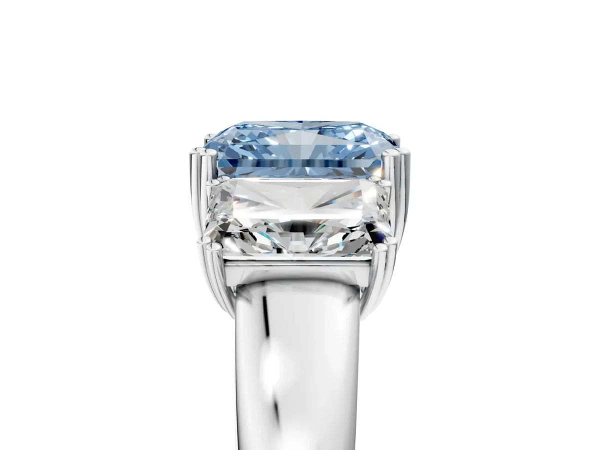 Fancy Blue Three-Stone Radiant Cut Cut Diamond Ring with Channel Set Band and Four-Prong Setting Silver