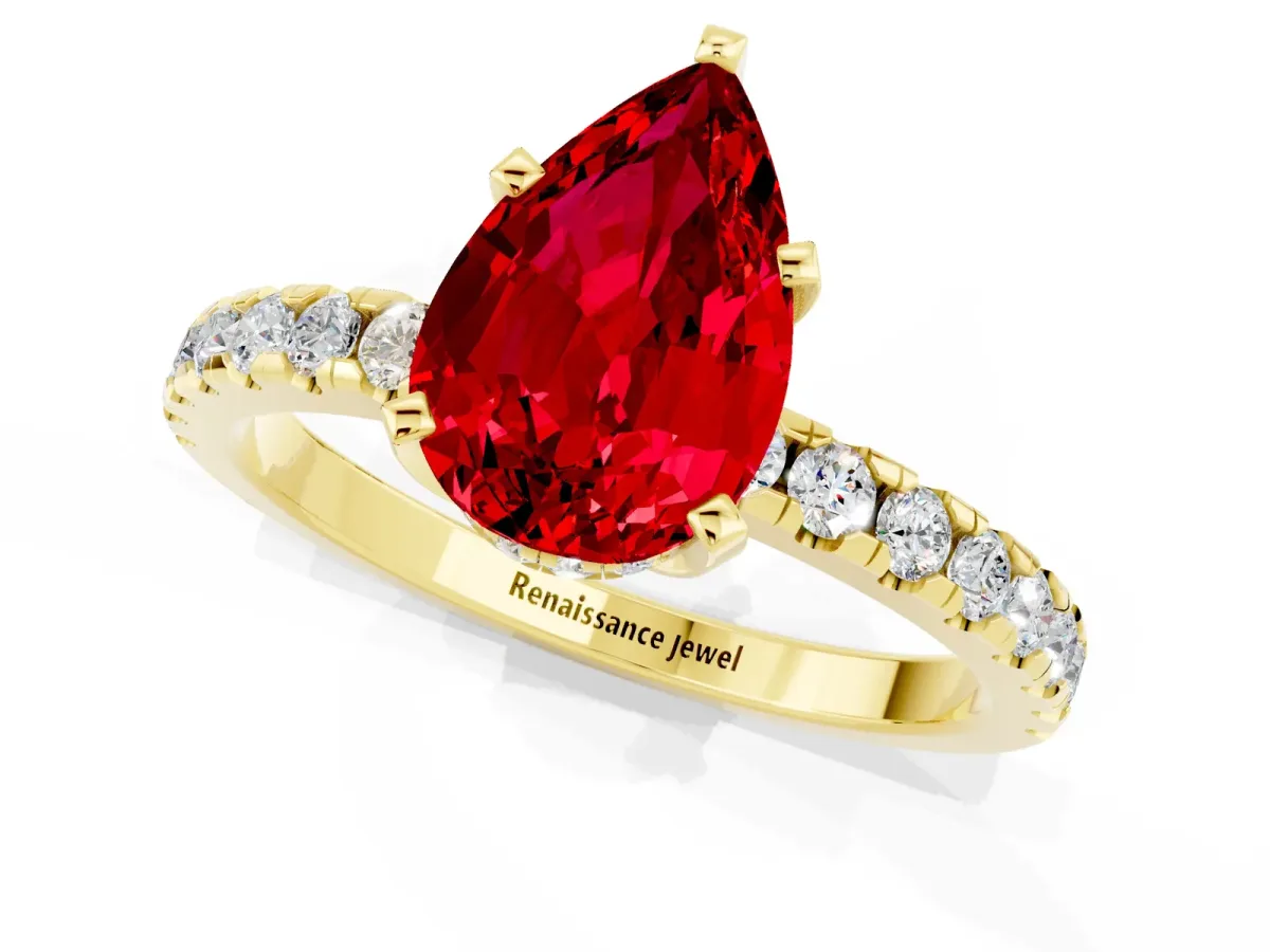 Pear Cut Ruby Solitaire Ring with Round Pavé Band and Four-Prong Setting Yellow gold