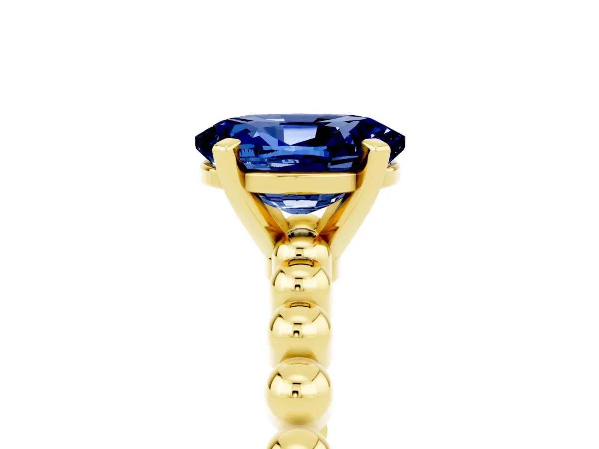 Oval Cut Blue Sapphire Solitaire Ring with Beaded Band and Prong Setting Yellow gold