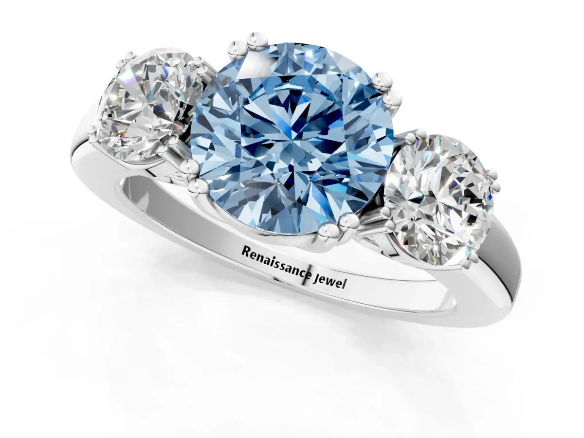 Fancy Blue Three-Stone Round Cut Cut Diamond Ring with Channel Set Band and Four-Prong Setting Platinum