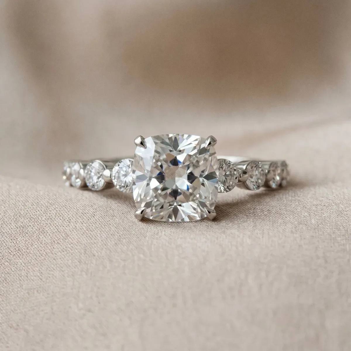 Cushion Cut Solitaire Diamond Ring with Pave Band and Four-Prong Setting Platinum