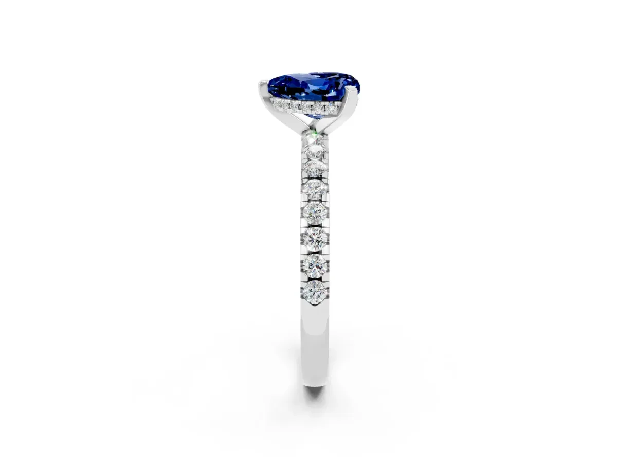Heart Cut Blue Sapphire Solitaire Ring with Round Pavé Band and Four-Prong Setting Silver