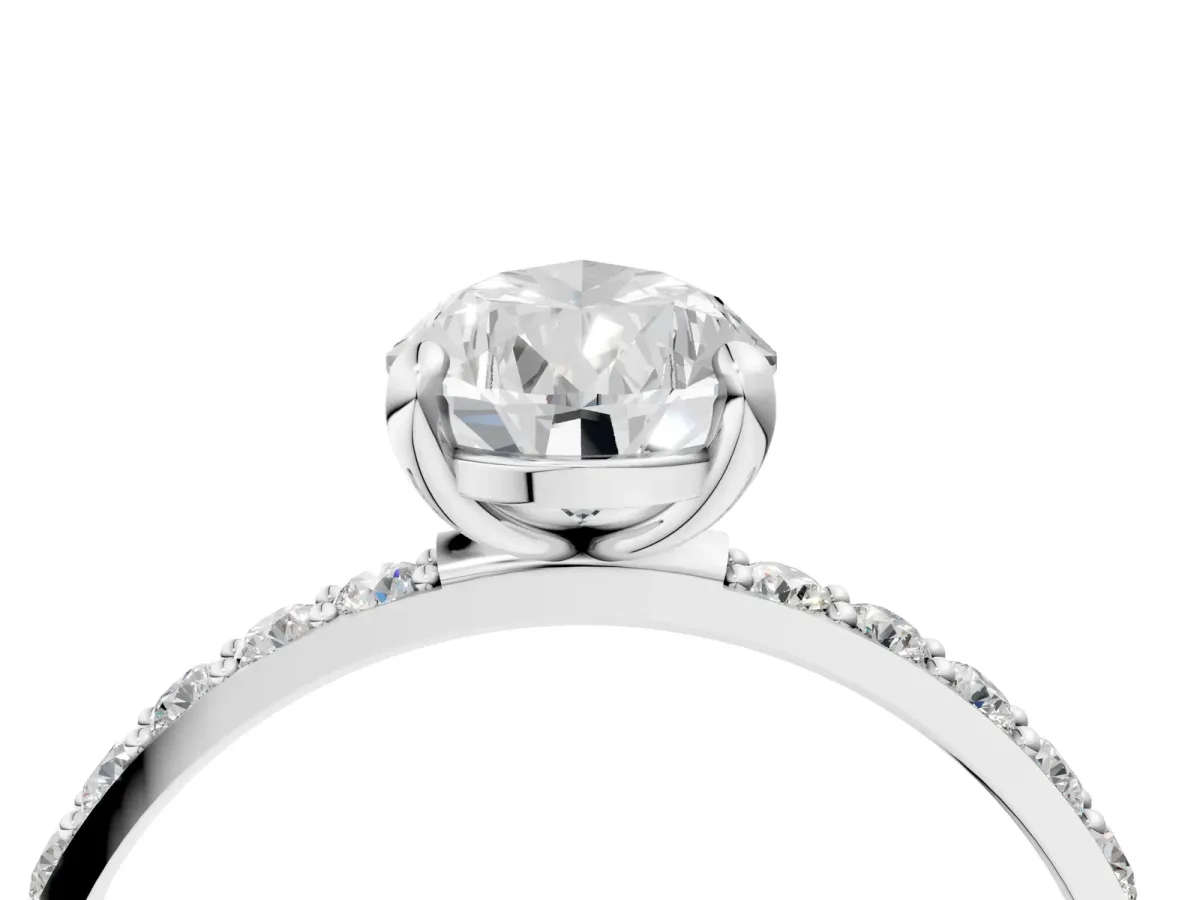 Pear Cut Diamond Solitaire Ring with Round Pavé Band and Prong Setting Silver