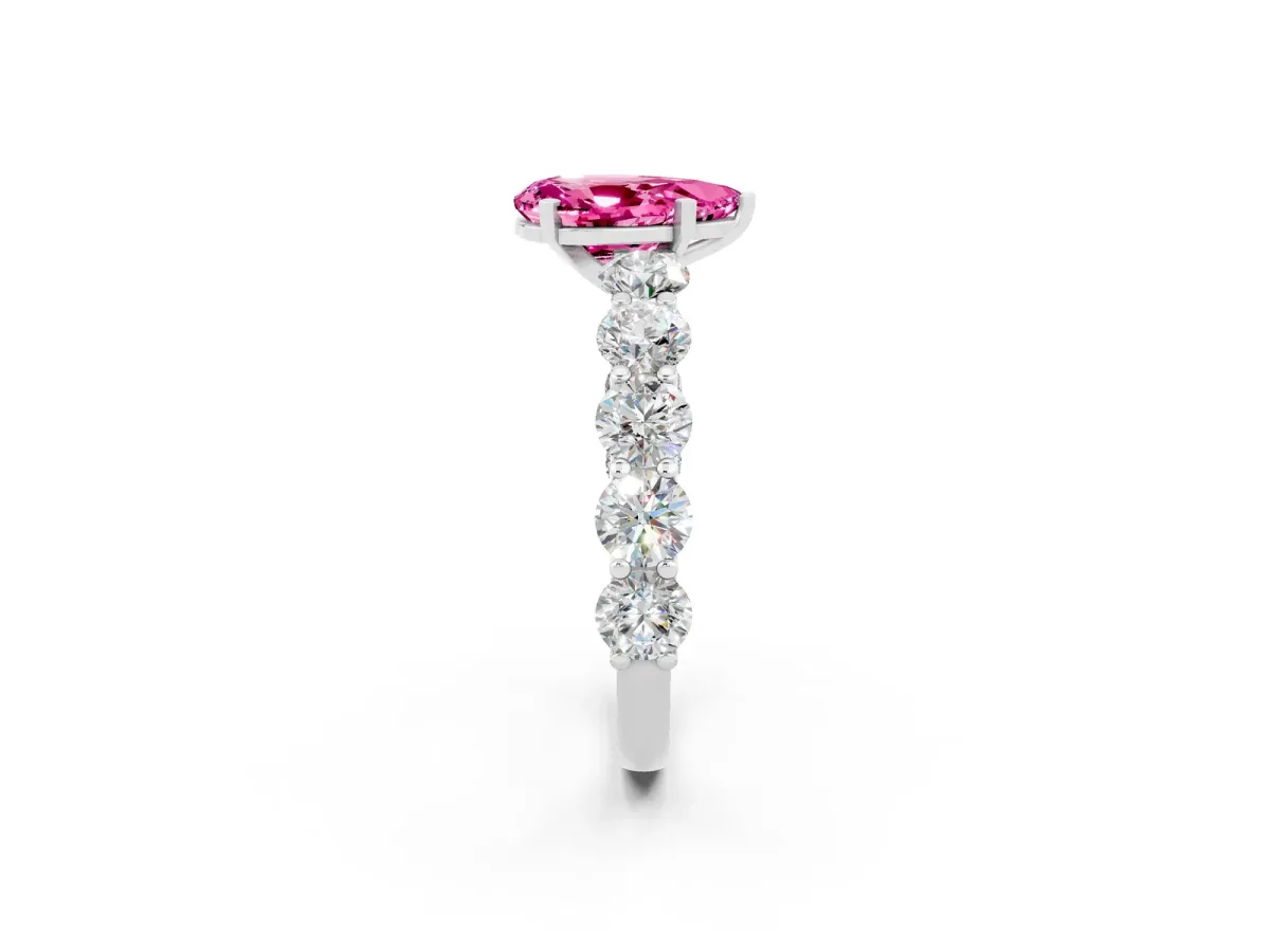 Pear Cut Pink Sapphire Prong Setting with Side Stones on a Pave Band Silver