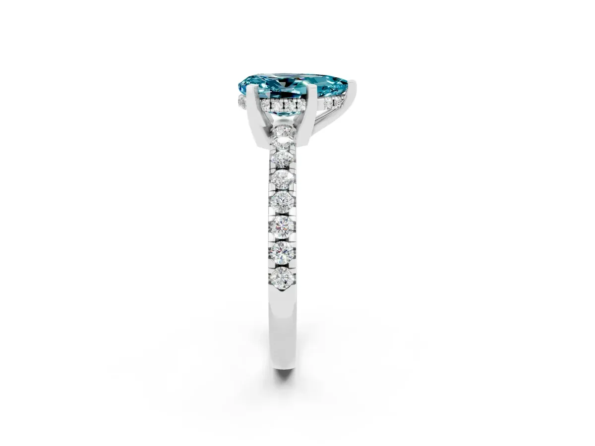 Pear Cut Blue Topaz Solitaire Ring with Round Pavé Band and Four-Prong Setting Silver