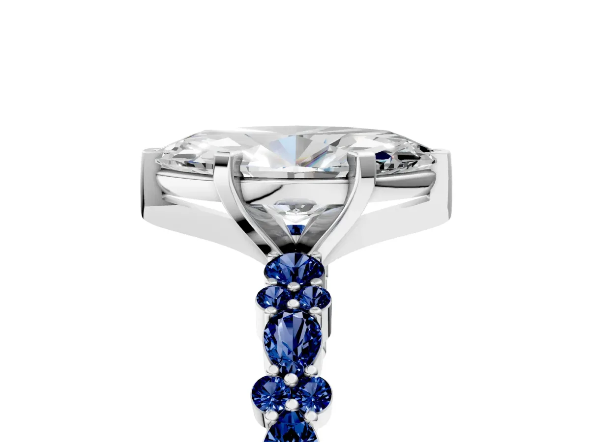 Marquise Cut Diamond Side Stone Solitaire Ring with Round Blue Sapphire and Four-Prong Setting Platinum