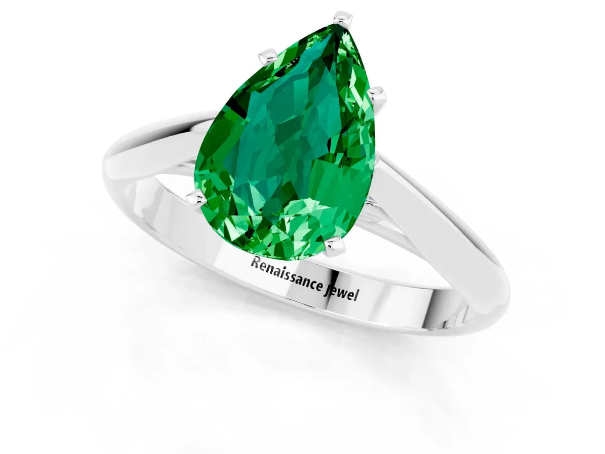 Pear Cut Emerald Solitaire Engagement Ring with Cathedral Setting and Four-Prong Mount White gold