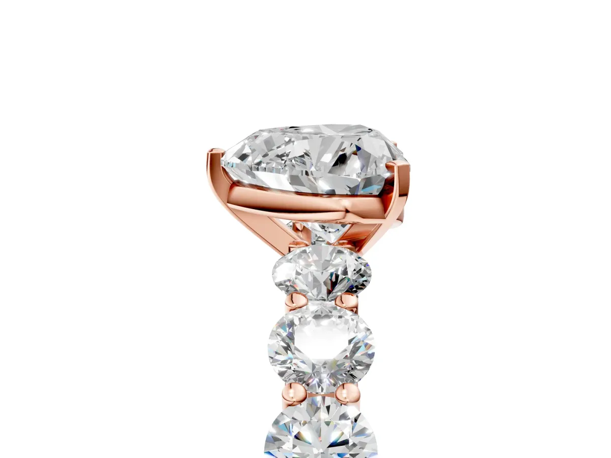 Heart Cut Diamond Prong Setting with Side Stones on a Pave Band Rose gold