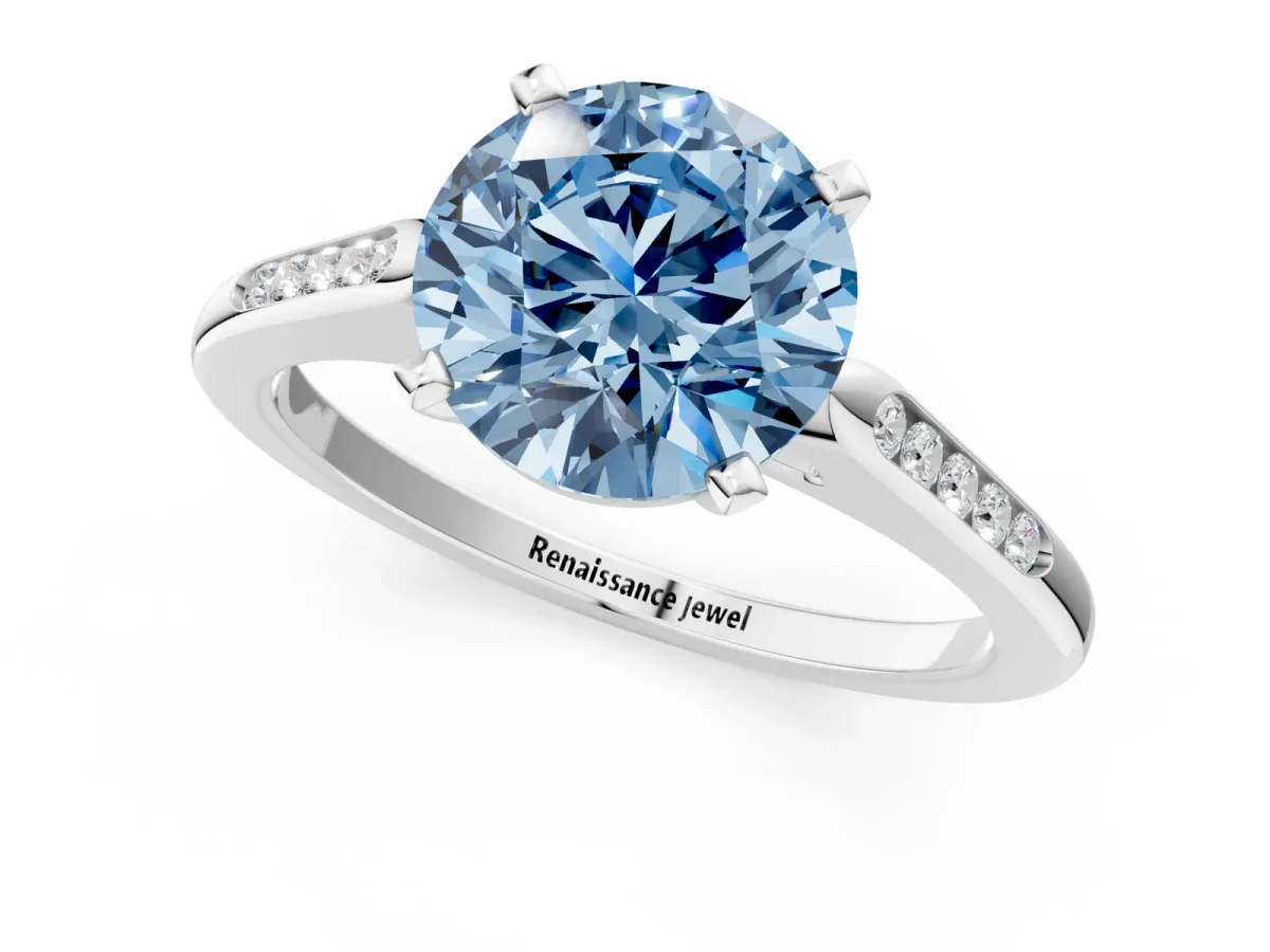 Fancy Blue Round Cut Diamond Solitaire Ring with Channel Set Round Band and Prong Setting Platinum