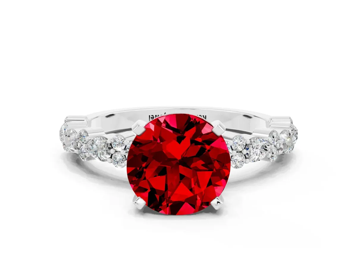 Round Cut Ruby Side Stone Solitaire Ring with Round and Four-Prong Setting White gold