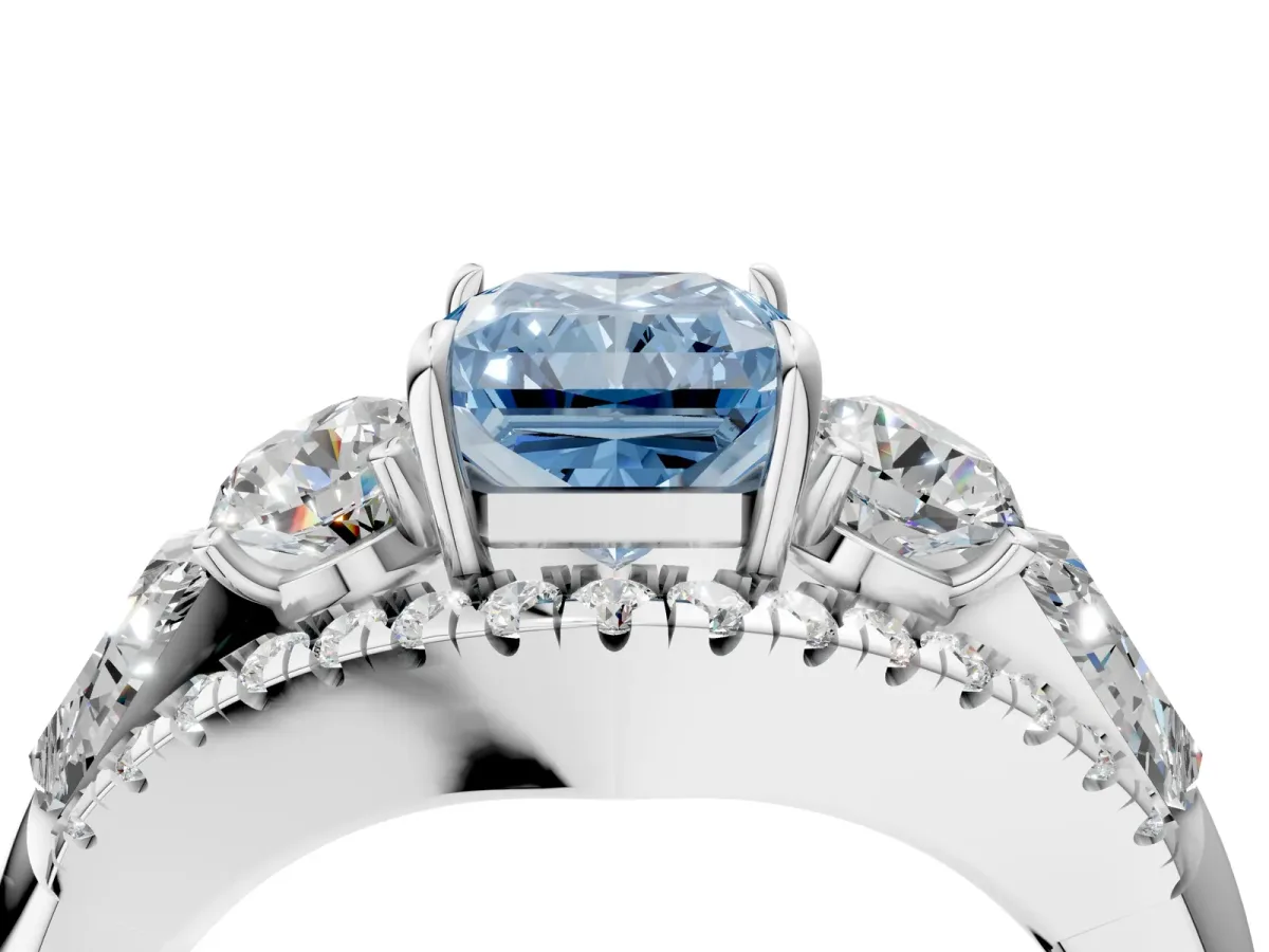 Fancy Blue Three-Stone Radiant Cut Diamond Engagement Ring with Pave Band and Prong Setting Platinum