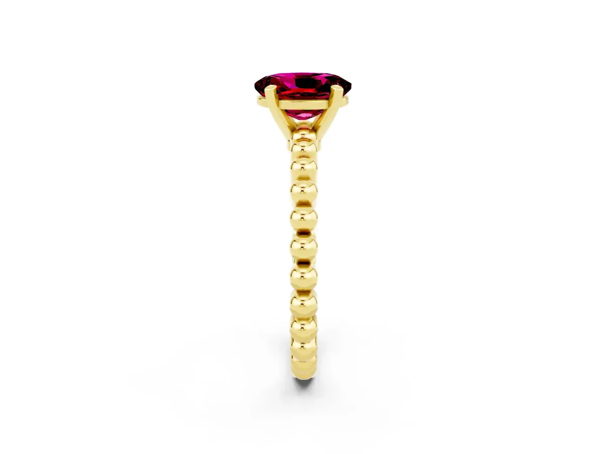 Oval Cut Garnet Solitaire Ring with Beaded Band and Prong Setting Yellow gold
