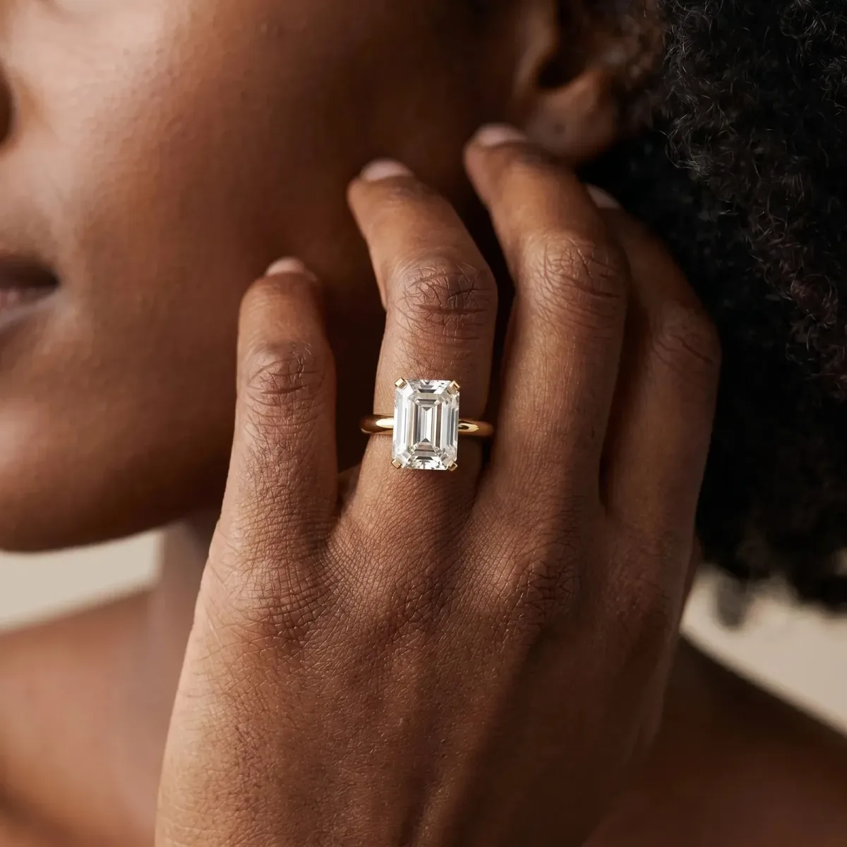 Emerald Cut Diamond Solitaire Ring with Six-Prong Setting and Classic Band Yellow gold